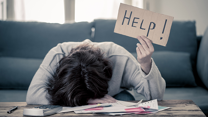 woman holding a help sign