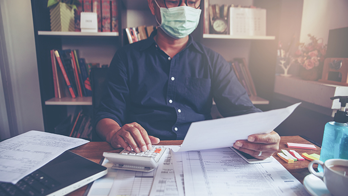 budgeting with a face mask
