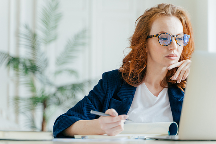 woman taking webinar