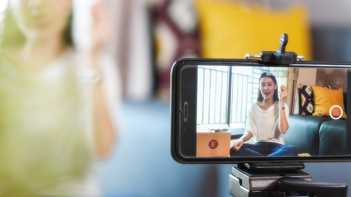 Beauty blogger demonstrating how to make up and review products