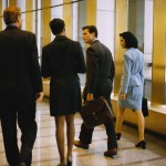 Business People Walking by Window Business People Walking by Window